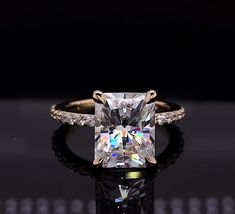 an engagement ring with a princess cut diamond