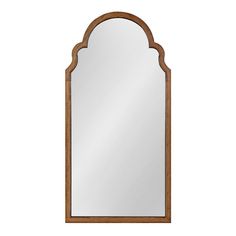 an arched wooden mirror on a white background