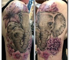 an elephant with flowers on his arm