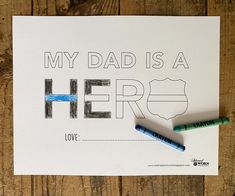 a father's day card that says, my dad is a hero with two crayons next to it