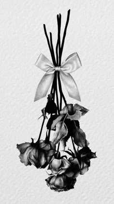 black and white photograph of flowers with bow