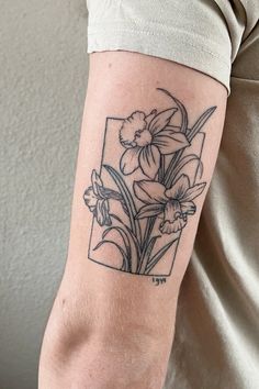 a person with a flower tattoo on their arm