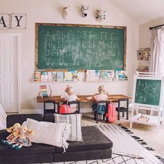 a child's playroom with chalkboard on the wall