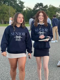 Custom Senior Sweatshirt  Sweatshirt colors:  Navy, Graphite Gray, Heathered Gray, Black, Light Pink You may pick 1 color for the word Senior and the rest will be in white (as shown) Thread Color: Red, Orange, Black, Navy, Light Pink, Light Gray, Green, Dark Gray, Black, Purple, Yellow, Lime (leave this color in the personalization box with name or in the comments box with the order.  If no color is picked I will stitch the same color as the sweatshirt) The name is also stitched on the left sleeve towards the cuff.  Please leave a SINGLE first name (this is not Lindsay Sue that is 2 names) in the Personalization box Please allow 7-14 business days to complete your sweatshirt. If you are looking for other colors, please send me a message. Free Shipping. School Spirit Crew Neck Sweatshirt For College Events, School Spirit Sweatshirt For College Events, School Spirit Long Sleeve Sweatshirt For College Events, Long Sleeve School Spirit Sweatshirt For College Events, Long Sleeve School Spirit Sweatshirt, School Fan Apparel Crew Neck Top, School Fan Apparel Tops With Crew Neck, Long Sleeve Sweatshirt With Text Print For School, Casual Long Sleeve Sweatshirt For College Events