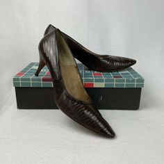 Vintage 1960s De Angelo Women's Heels Brown Genuine Lizard Size 9.5 AAA Brown reptile skin heels 2.75" heels Size 9 1/2 AAA Good wearable, vintage condition. Light signs of use on soles.  Includes original box Reptile Skin, Heels Brown, Women's Heels, Lighted Signs, Vintage 1960s, Womens Heels, Sling Backs, Original Box, 1960s