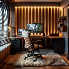 a home office with a desk, chair and television in the corner on top of a rug