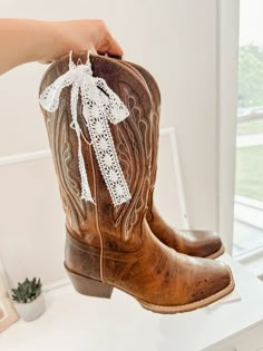 white bows, boots with bows, bows on boots, cowgirl boots, cowboy boots, country, cute boots, girly boots, coquette boots, coquette aesthetic Cowgirl Boots With Wedding Dress, Bows On Boots, Boots With Bows, Boots With Ribbon, Ribbon On Cowgirl Boots, Love Shack Fancy Cowboy Boots, Vintage Winter Boots For Western-themed Events, Bows On Cowboy Boots, Country Athestic Boots