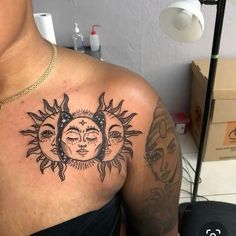 a woman with sun and moon tattoos on her chest