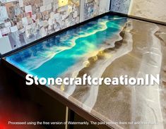 a glass table with the words stonecraft creation in front of it and an image of a beach