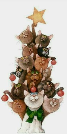 a group of cats sitting on top of each other in front of a christmas tree