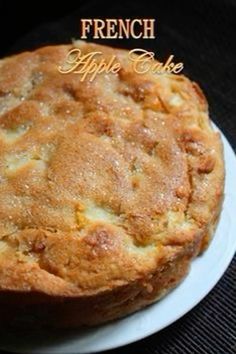 a close up of a cake on a plate with the words french apple cake above it