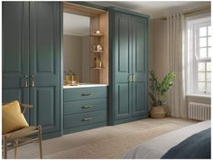 a bedroom with green cupboards and white walls