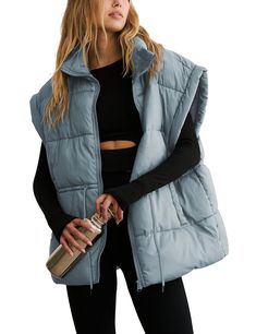 PRICES MAY VARY. Material: classic versatile puffy vest for women, lightweight warm black sleeveless padded gilet, made of soft, skin-friendly high quality polyester fabric, comfy to wear, keeping you warm during chilly days Features: womens full zip thick quality padded vest, adjustable drawstring waistband, stand collar, two side pockets, slight exaggerated shoulders, solid color, oversized style with a slouchy fit, stylish basic sleeveless padded coat allows most types of bodyshape Matching: Oversized Puffer Vest, Winter Puffer Vest, Oversized Puffer Jacket, Oversized Puffer, Fall Vest, Womens Puffer Vest, Quilted Puffer Vest, Black Puffer Vest, Puffy Vest