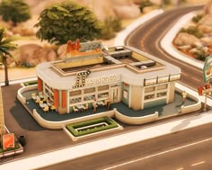 a model of a building on the side of a road