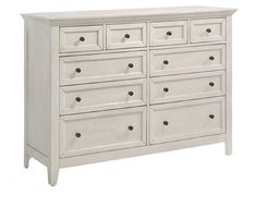 a white dresser with many drawers on it