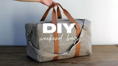 a person holding a duffel bag with the words diy weekend bag on it