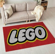 a living room with a couch and rug that says lego