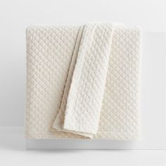 two white towels folded on top of each other