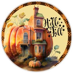 a round sticker with an image of a house and pumpkins