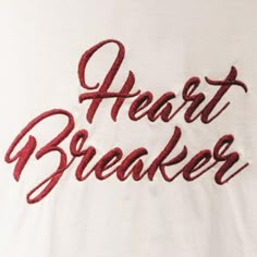 the words heart breaker written in red ink on a white t - shirt that says,