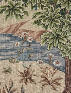 a tapestry with trees and flowers on it