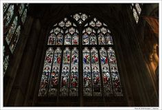 a large stained glass window in the middle of a building