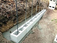 concrete blocks are attached to the side of a wall