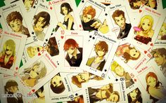 many playing cards with pictures of people on them are arranged in the shape of hearts