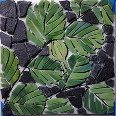 a painting with green leaves and black rocks