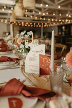 the table is set with place cards and napkins for guests to sit down at