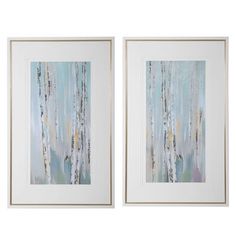 two framed art pieces with blue and white trees in the background, one is hanging on a wall