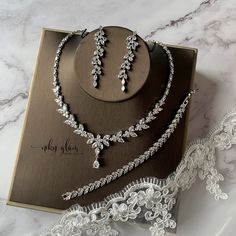 the wedding jewelry set is on display next to its box