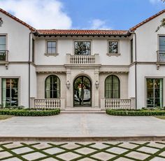 a large white house with lots of windows