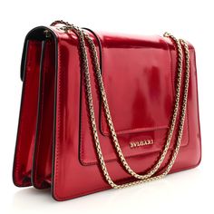 This is an authentic BULGARI Metallic Calfskin Serpenti Forever Shoulder Bag in Red. This striking bag is crafted of calfskin leather in metallic red. The bag features a front flap with an enameled snake head closure, gold hardware, and gold chain link shoulder strap. The flap opens to a partitioned black leather interior with a central zipper compartment and patch pockets. Snake Head, Leather Interior, Gold Hardware, Chain Link, Gold Chain, Patch Pocket, Gold Chains, Calf Skin, Shoulder Strap