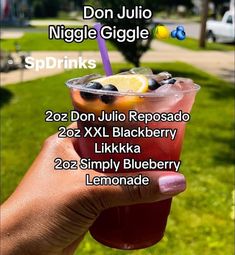 a person holding up a drink in front of the camera with text overlay that reads don jujulo niggle giggle sprinkles