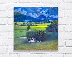 a painting on a brick wall with green grass and trees in the foreground, blue mountains in the background