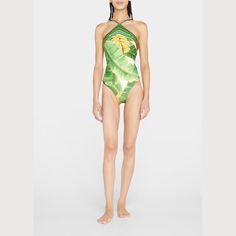 Farm Rio one-piece swimsuit in "Fresh Forest" print  Halter neckline Adjustable straps High-cut legs  Scoop back Cheeky seat coverage  Polyester/elastane Made in Brazil Printed Elastane Tankini For The Beach, Halter Neck Tankini For Vacation, Printed Elastane Swimwear For Beach, Printed Elastane Swimwear For Beach Season, Backless Beachwear Bodysuit, Green Elastane Bodysuit For Summer, Green Swimwear For The Pool, Green Swimwear For Pool, One-piece Elastane Bodysuit For The Beach