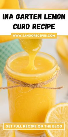 a jar filled with lemon curd next to sliced lemons