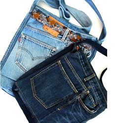 three different types of jeans are stacked on top of each other, with one bag in the middle