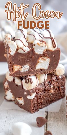 hot cocoa fudge brownies stacked on top of each other with marshmallows