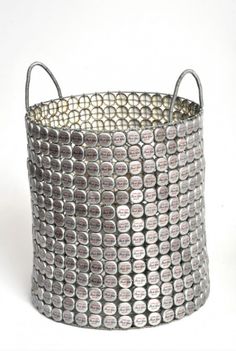 a large metal basket sitting on top of a white table