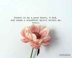 a pink flower sitting on top of a white wall next to a quote that reads, create in a pure heart, o god, and rejo