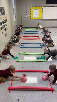 children playing with inflatable balls on the floor