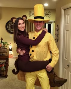 a man and woman dressed up in costumes