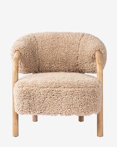 a chair made out of sheepskin with wooden legs and arms, on a white background