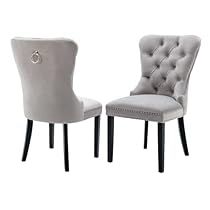 two gray chairs sitting next to each other