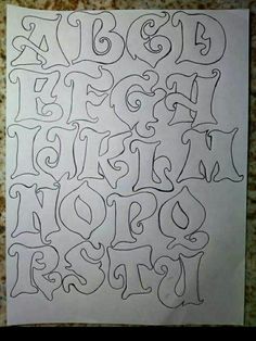 a piece of paper that has some type of lettering on it, and the letters are drawn