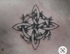 a black and white tattoo design on the chest