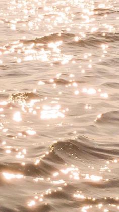 the sun shines brightly on the water as it reflects off the surface of the ocean