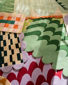 an assortment of colorful rugs on the floor